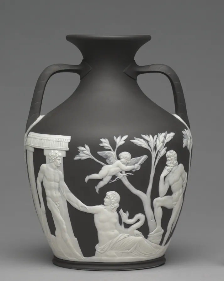 A black Wedgwood jasperware vase with white classical figures applied in relief